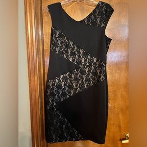 Black shift dress with tan and lace accents great for cocktail or evening.